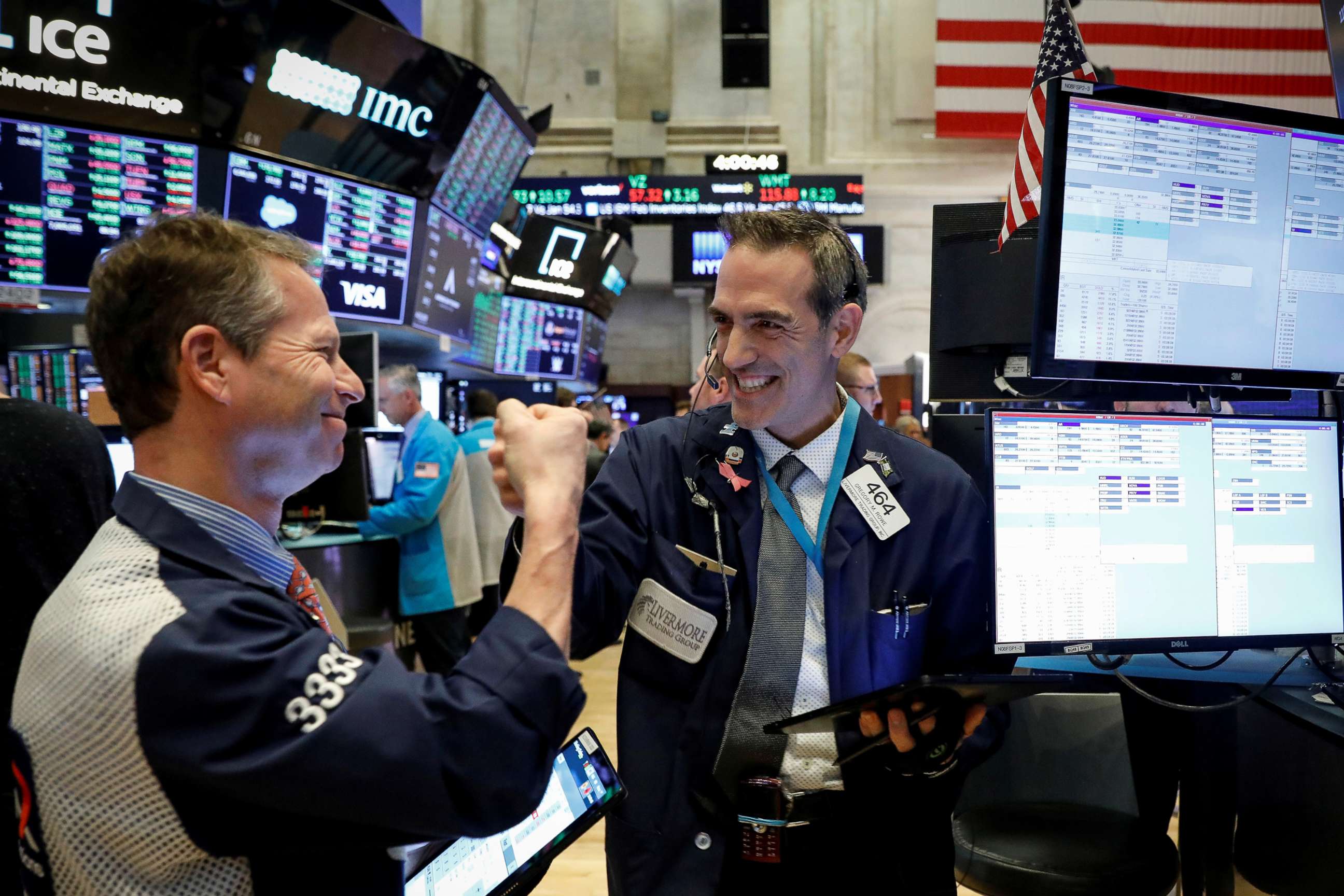 PHOTO: Traders celebrate as they work on the floor at the New York Stock Exchange in New York, March 2, 2020.