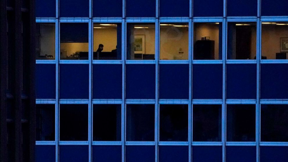 PHOTO: In this Jan. 26, 2021, file photo, employees work in an office building in midtown Manhattan in New York.
