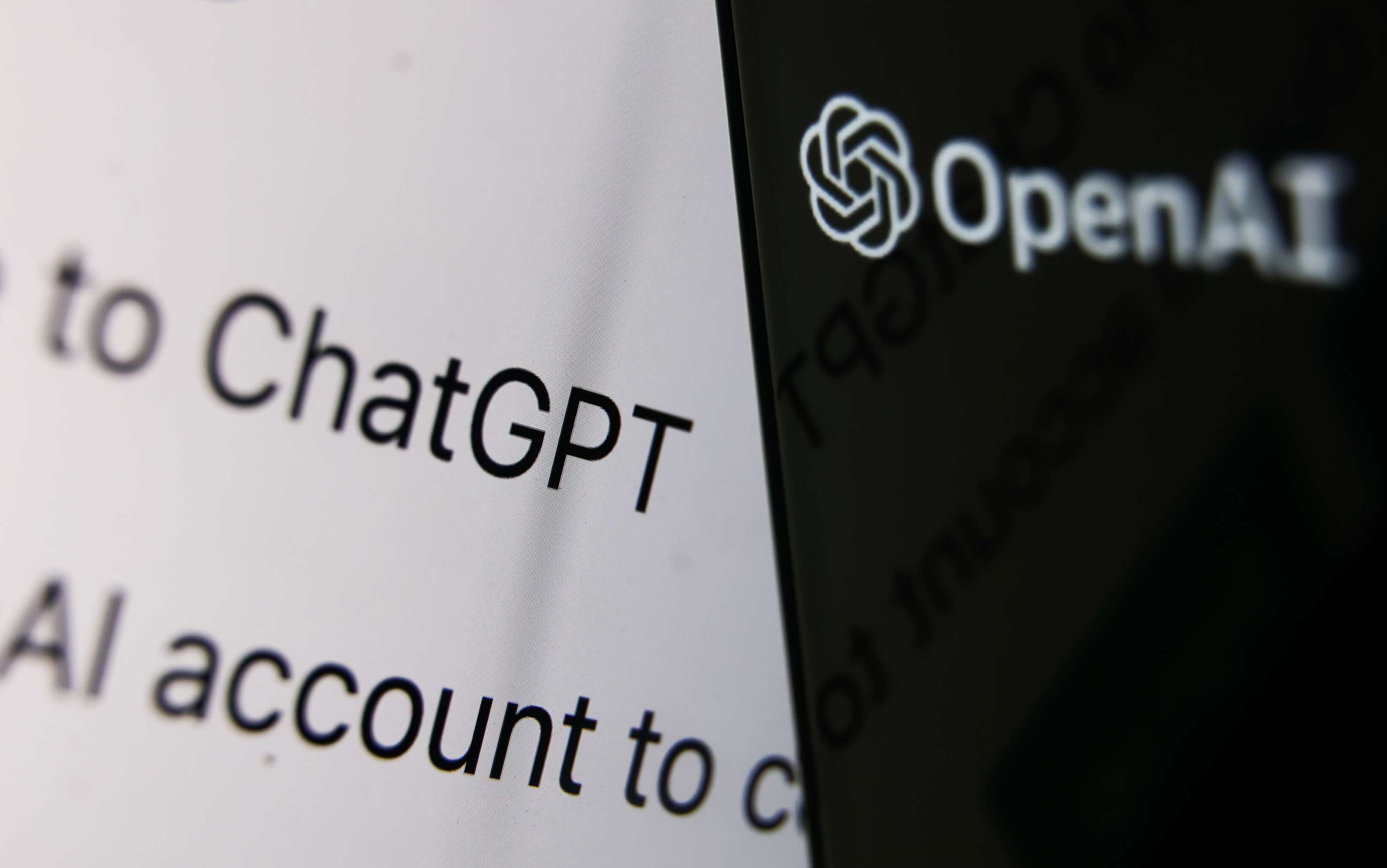 PHOTO: Illustration photo of OpenAI logo displayed on a phone screen and ChatGPT website displayed on a laptop screen.