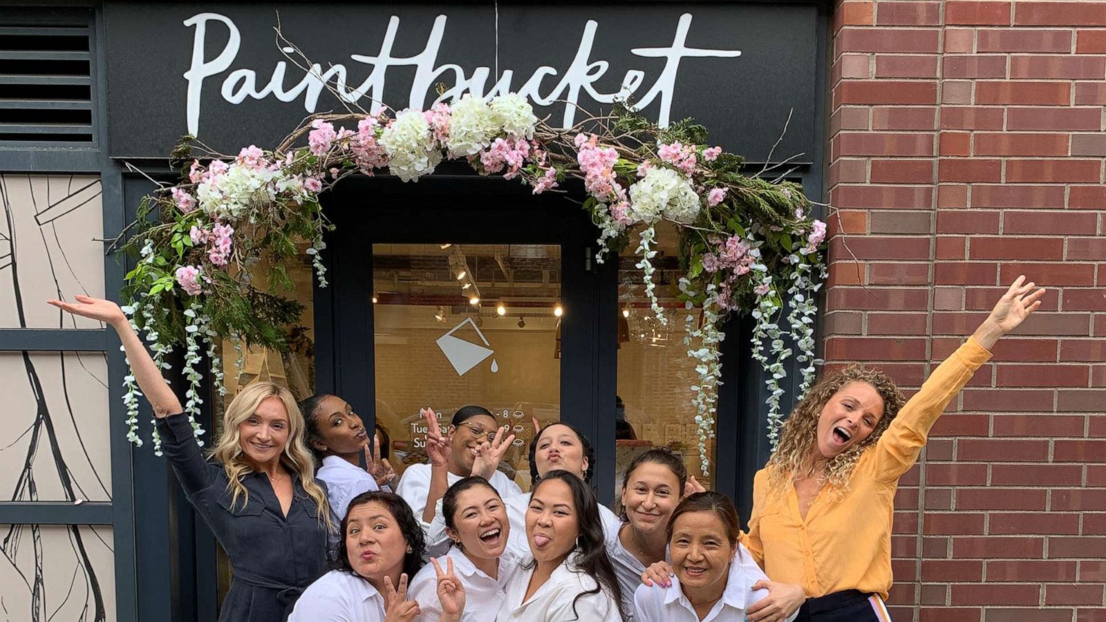 PHOTO: Paintbucket founder, Kristin Pulaski alongside of her team outside of their Brooklyn nail salon.