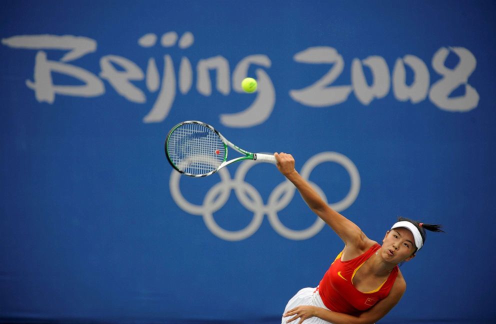 PHOTO: Peng Shuai of China returns a shot against Carla Suarez Navarro of Spain during their women's first round tennis match at the Beijing 2008 Olympic Games, Aug. 11, 2008.