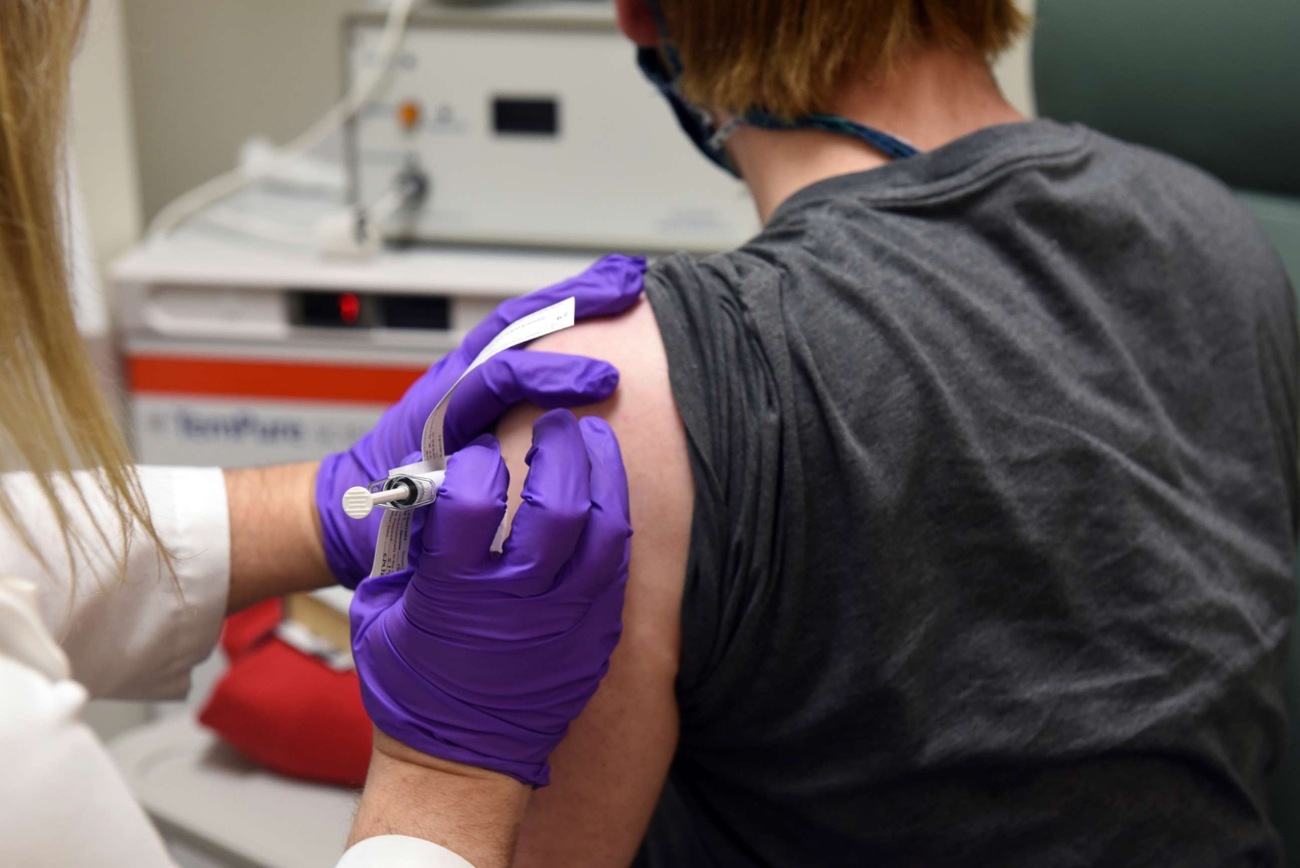 PHOTO: The first patient enrolled in Pfizer's COVID-19 coronavirus vaccine clinical trial at the University of Maryland School of Medicine in Baltimore receives an injection, May 4, 2020.