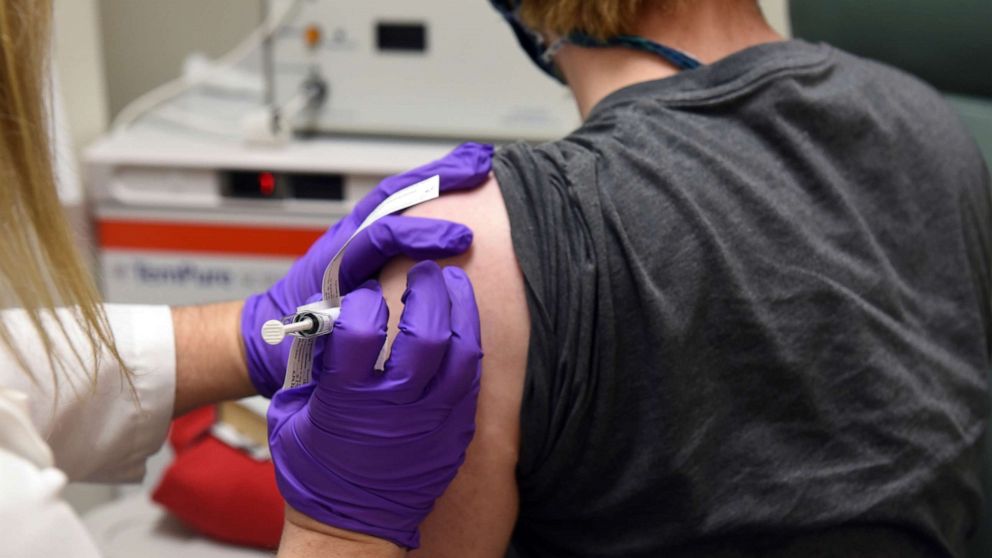 PHOTO: The first patient enrolled in Pfizer's COVID-19 coronavirus vaccine clinical trial at the University of Maryland School of Medicine in Baltimore receives an injection, May 4, 2020.
