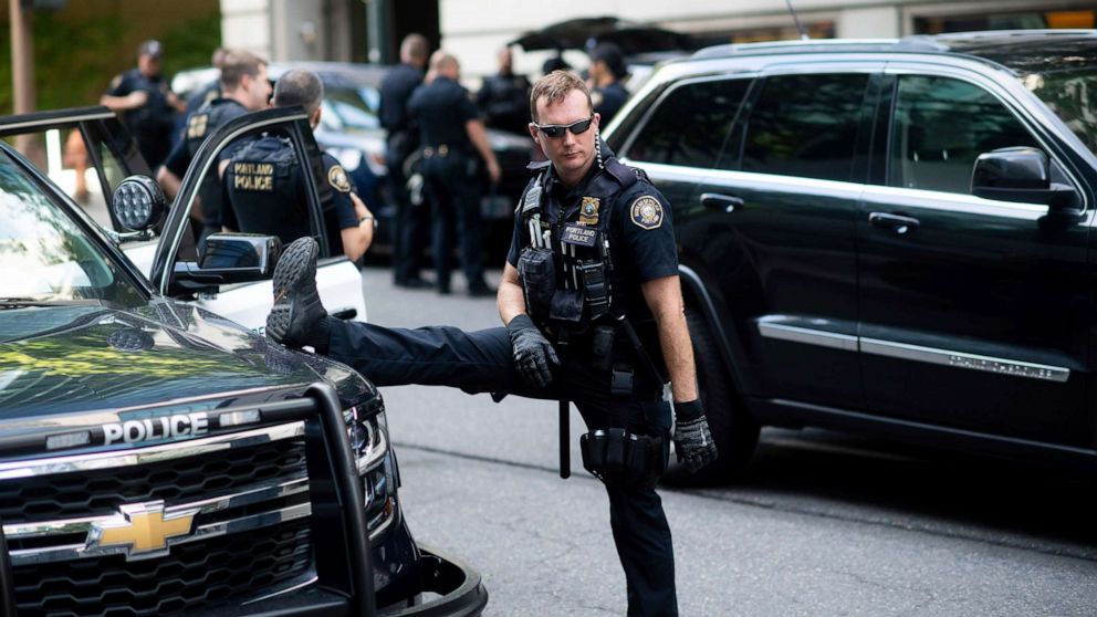 PHOTO: Portland police officer Bonczijk stretches before the start of a protest in Portland, Ore., on Saturday, Aug. 17, 2019.