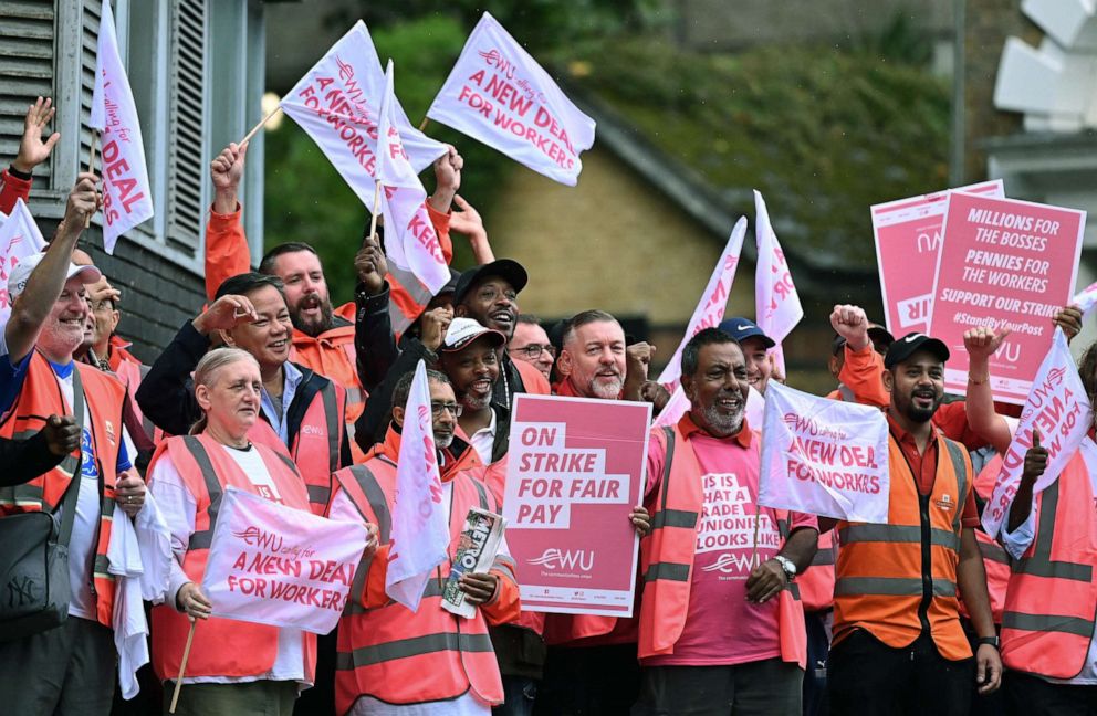 PHOTO: Royal Mail postal workers hold placards and chant slogans as they stand on a picket line outside a delivery office, in north London, Sept. 8, 2022, during a strike. 