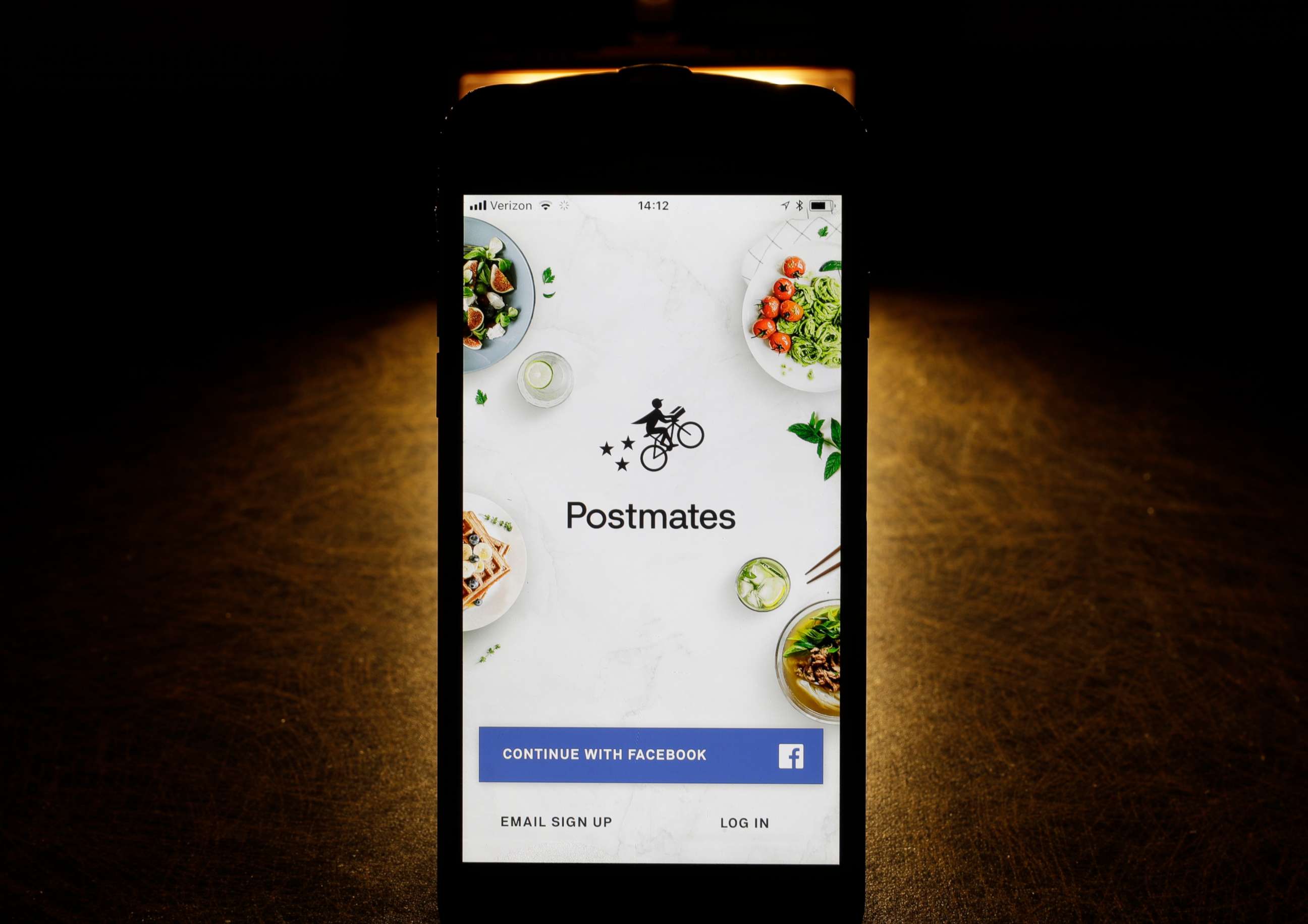 PHOTO: This Tuesday, Feb. 20, 2018, photo shows the Postmates app on an iPhone in Chicago.