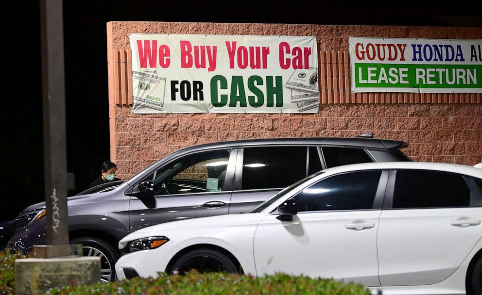 PHOTO: A sign advertises cash paid for used cars in Alhambra, Calif. on Jan. 12, 2022.  Prices rose for an array of goods especially housing, cars and food.