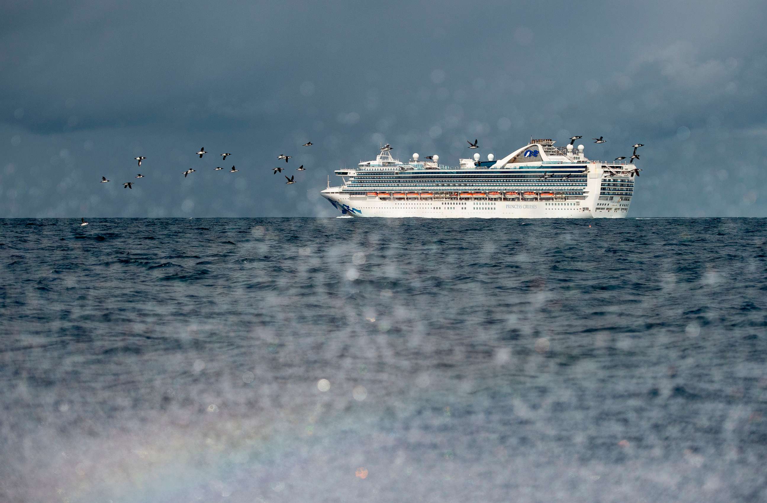 PHOTO: People look out from aboard the Grand Princess cruise ship, operated by Princess Cruises, as it maintains a holding pattern about 25 miles off the coast of San Francisco, March 8, 2020.