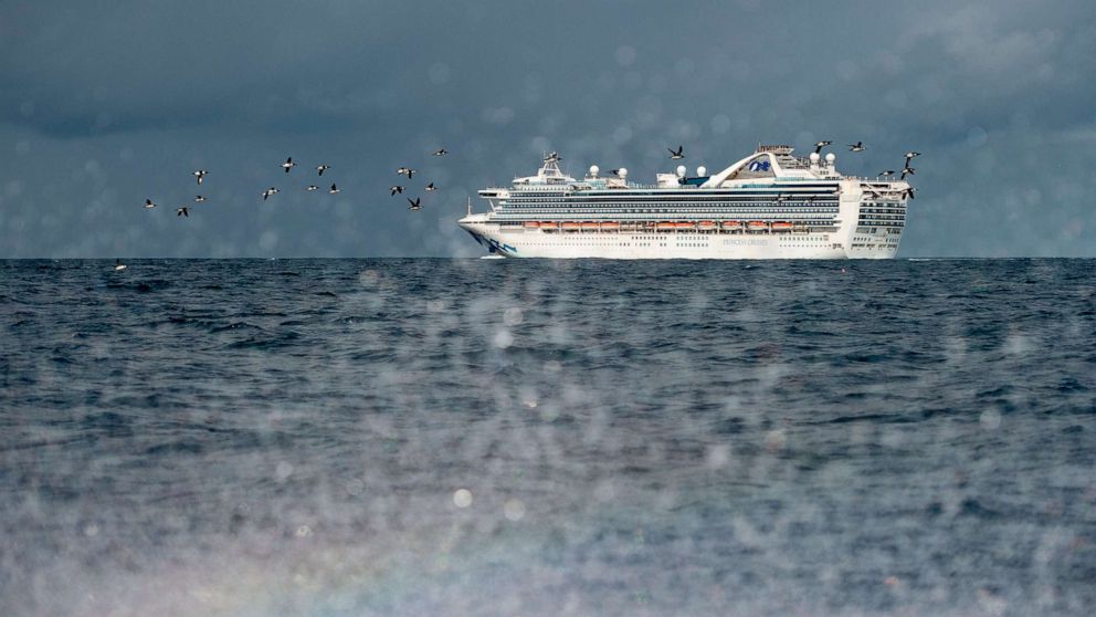PHOTO: People look out from aboard the Grand Princess cruise ship, operated by Princess Cruises, as it maintains a holding pattern about 25 miles off the coast of San Francisco, March 8, 2020.