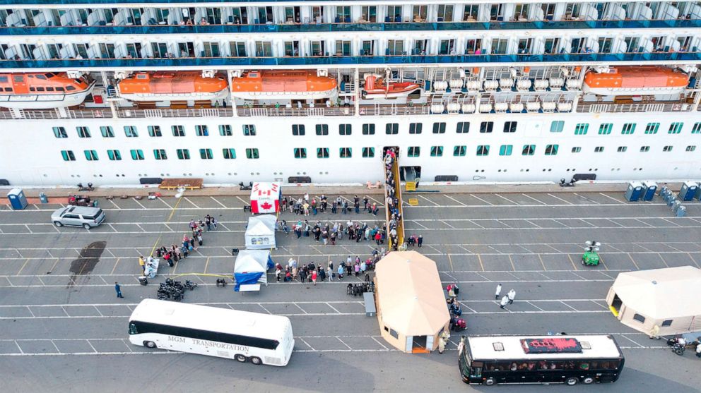 PHOTO: Passengers are disembarked from the Grand Princess cruise ship at the Port of Oakland in California on March 9, 2020.