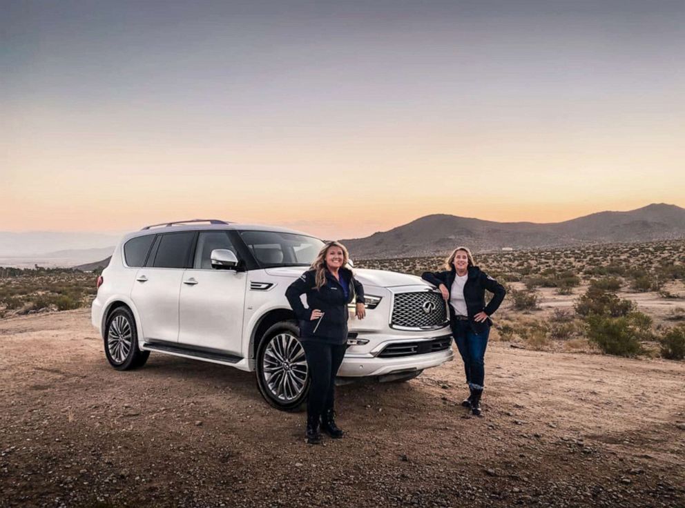 PHOTO: Alice Chase, left, and Nicole Wakelin, right, pose with the Infiniti QX80 SUV they will pilot at this year's Rebelle Rally.