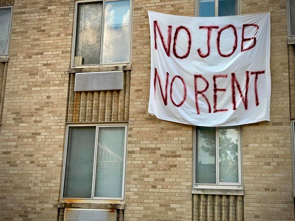PHOTO: (A banner against evictions is displayed on a rent-controlled building in Washington, Aug. 9, 2020.