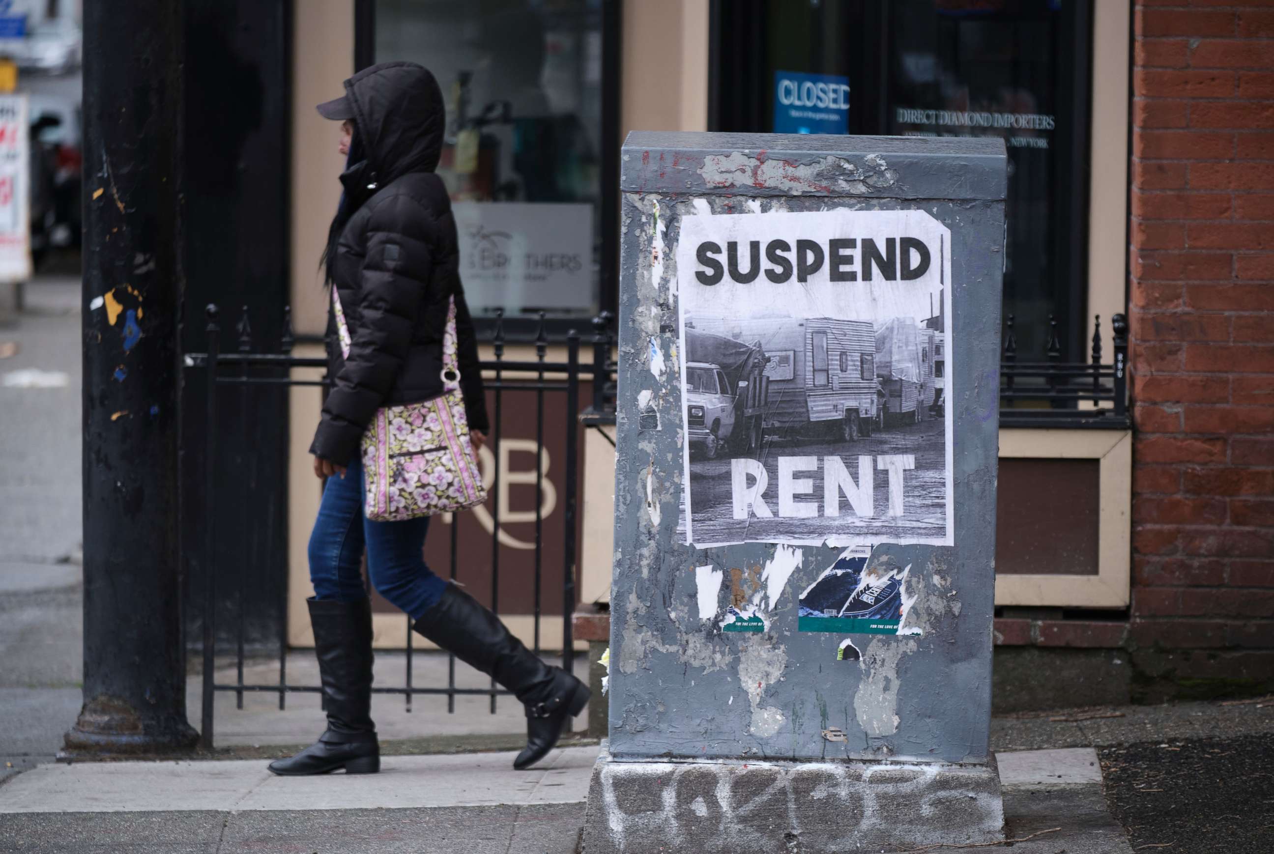 PHOTO: A sign calling for the suspension of rent during the COVID-19 outbreak is pictured in downtown Seattle, March 26, 2020. Unemployment claims in the area have shot up recently as the economy had ground to a halt.