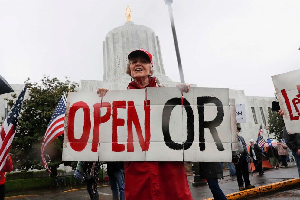 PHOTO: Ruth Jacobs, 84, of Oregon City holds a sign saying Open OR at the ReOpen Oregon Rally, May 2, 2020, in Salem, Oregon.