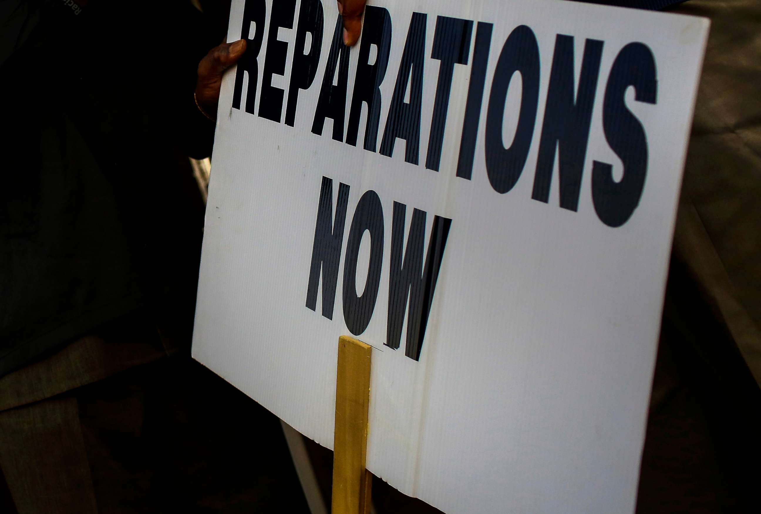 PHOTO: A reparations now sign is seen at a protest on Nov. 18, 2020, in Tulsa, Oklahoma.