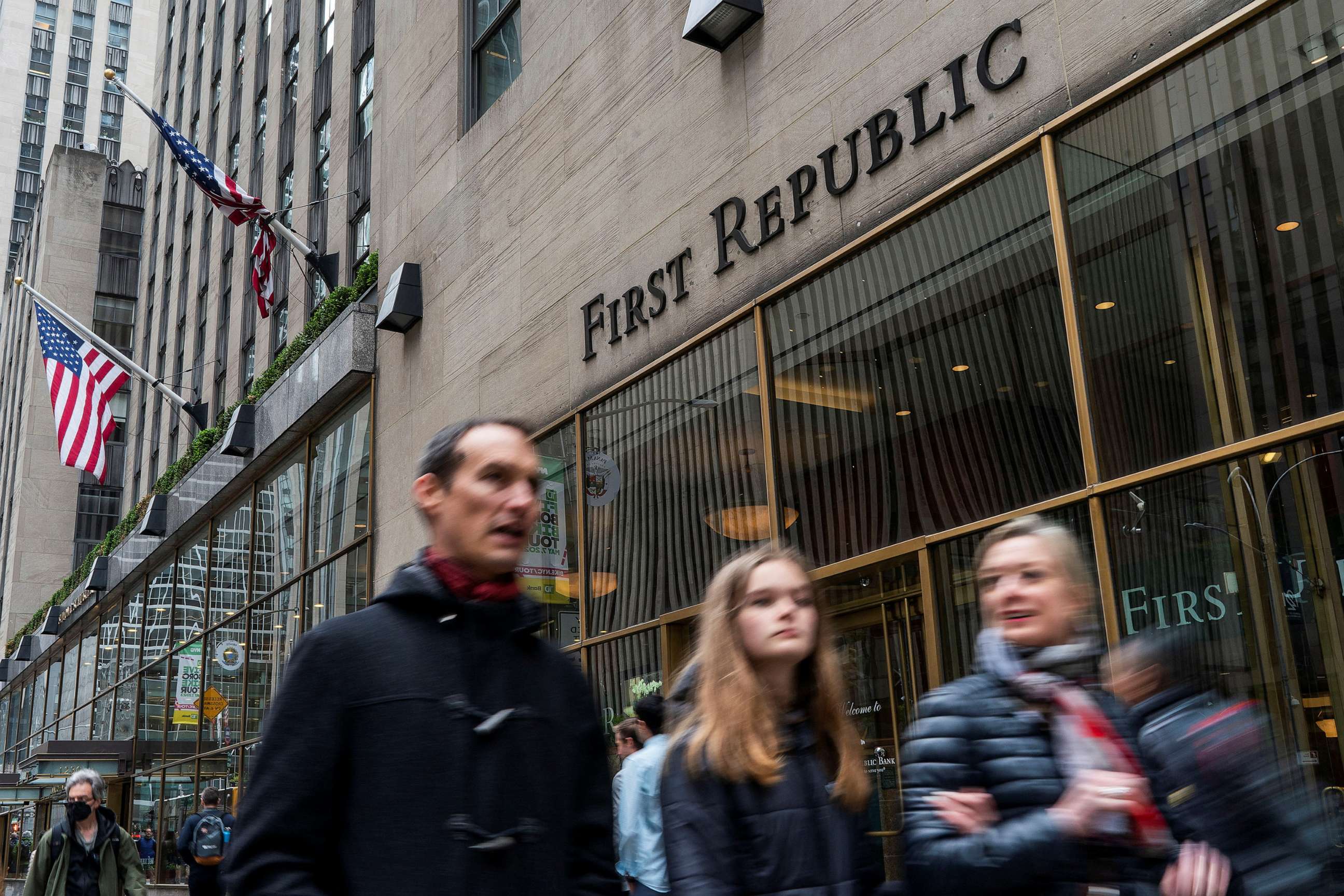 PHOTO: People walk near one of the First Republic Bank branches in New York, April 28, 2023.