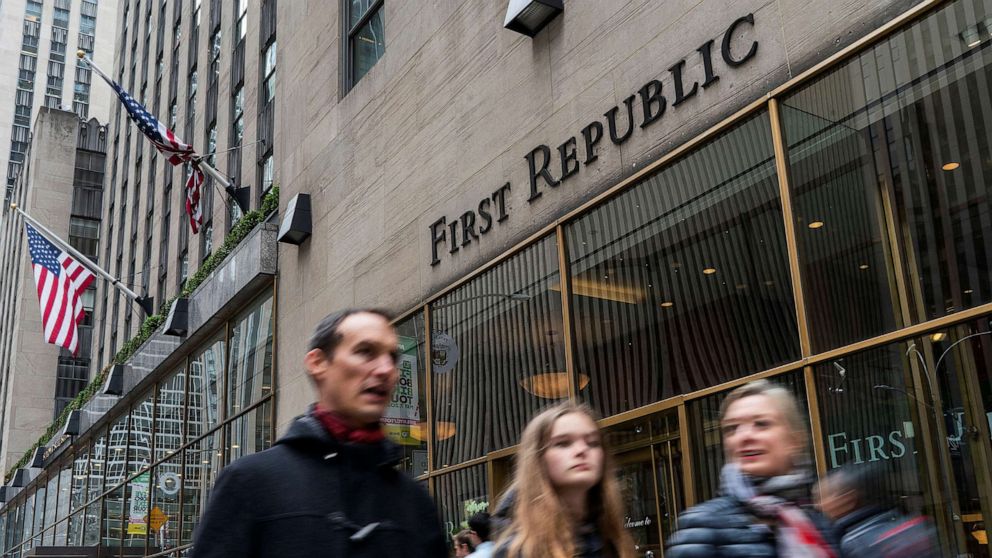 PHOTO: People walk near one of the First Republic Bank branches in New York, April 28, 2023.