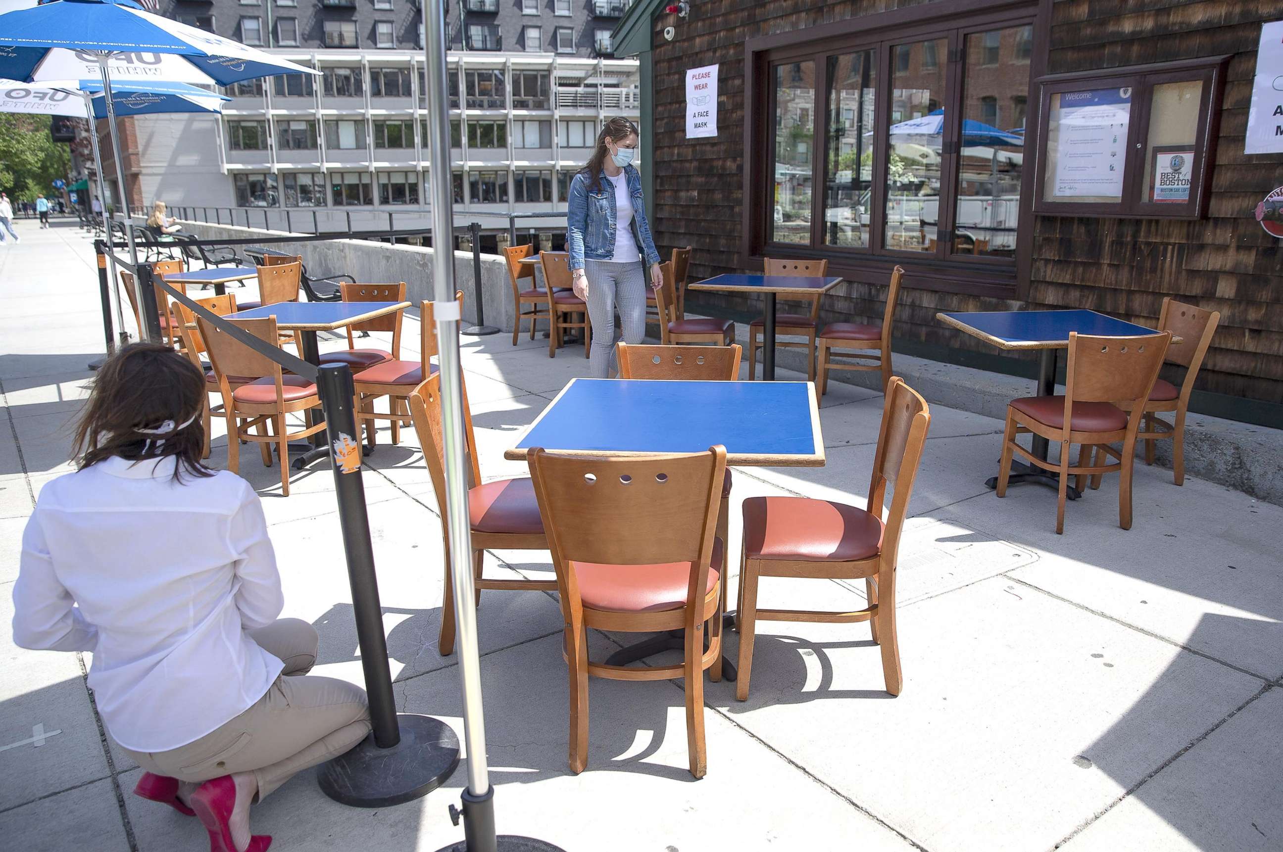 PHOTO:Meredith Tipping (L) and Caroline Tipping (R) of the Boston Sail Loft Restaurant prepare for outdoor dining at the eatery in Boston, June 10, 020. 