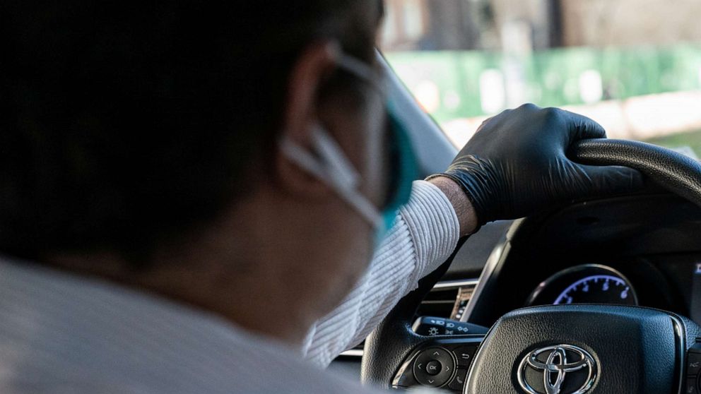 PHOTO: An Uber driver wearing a protective glove is seen in the Manhattan borough, following the outbreak of coronavirus disease (COVID-19), in New York City, March 15, 2020.