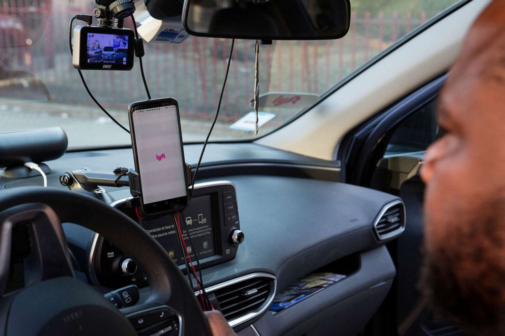 PHOTO: Uber and Lyft driver Adama Fofana sits in his car in New York City, March 9, 2020. 