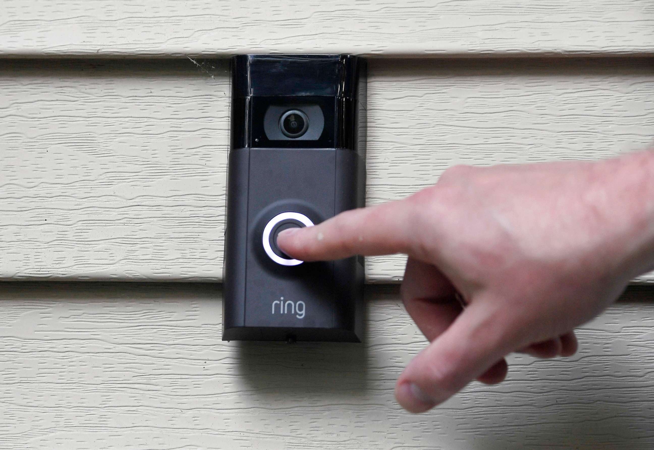PHOTO: In this July 16, 2019, file photo, Ernie Field pushes the doorbell on his Ring doorbell camera at his home in Wolcott, Conn.