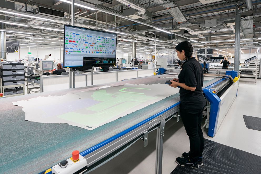 PHOTO: Rolls-Royce worker inspecting the leather for imperfections at the automaker's headquarters in Goodwood, England. 
