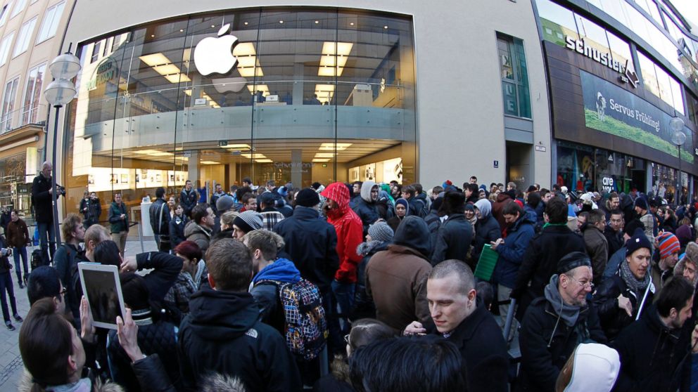 People crowd in front of an Apple store in Munich, Germany, in this March 16, 2012 photo.