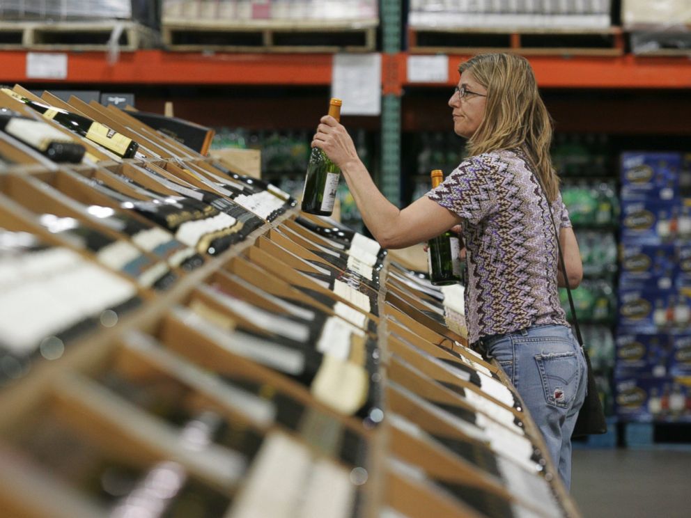 PHOTO: A shopper selects bottles of wine at the Costco Warehouse in Arlington, Va.on May 29, 2008.