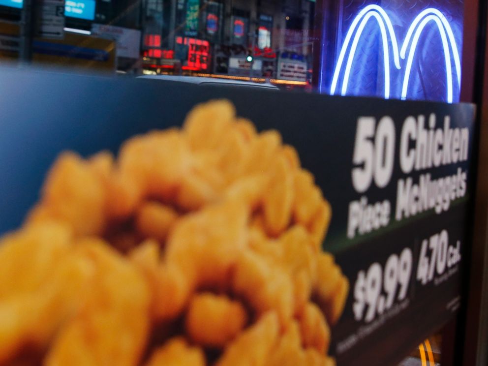PHOTO: Neon McDonalds Golden Arches are seen at the Times Square location in New York City on Jan. 29, 2015.