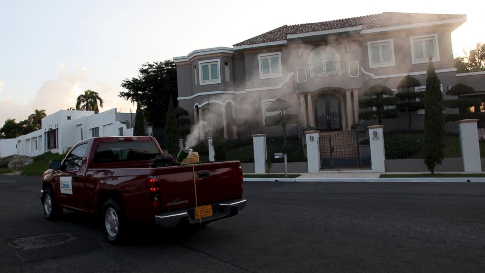 A pick-up truck from the Department of Health releases a pesticide to prevent the spread of Zika carrying mosquitos in San Juan, Puerto Rico, Jan. 27, 2016.