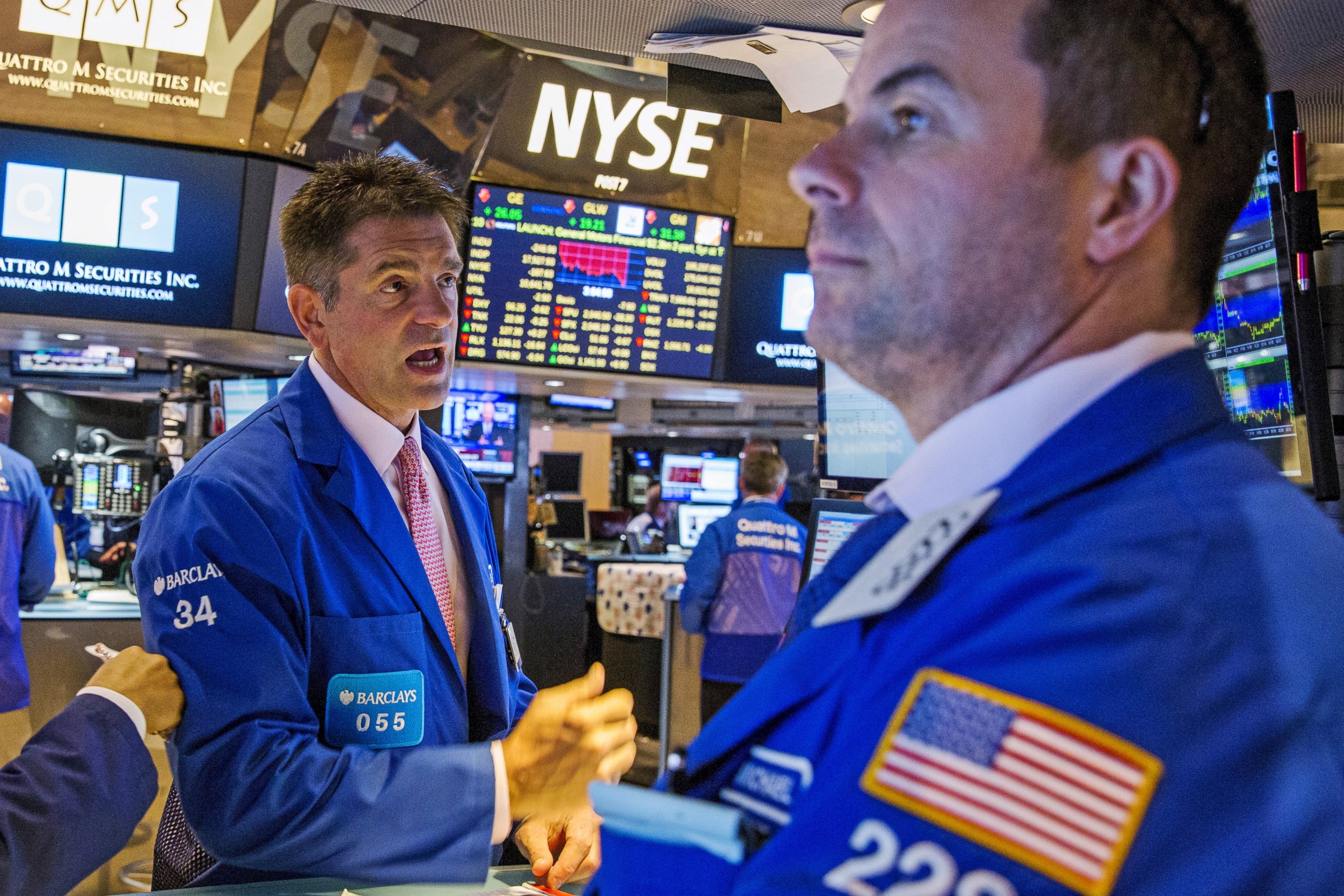 PHOTO: Traders attempt to figure out what is happening as trading resumes following a several hour long stoppage on the floor of the New York Stock Exchange in New York, July 8, 2015.