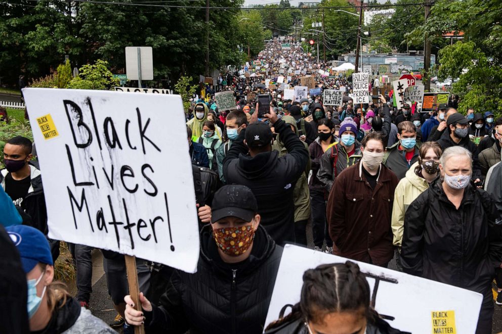 PHOTO: Protesters silently march up 23rd Avenue South in Seattle, Washington on June 12, 2020.