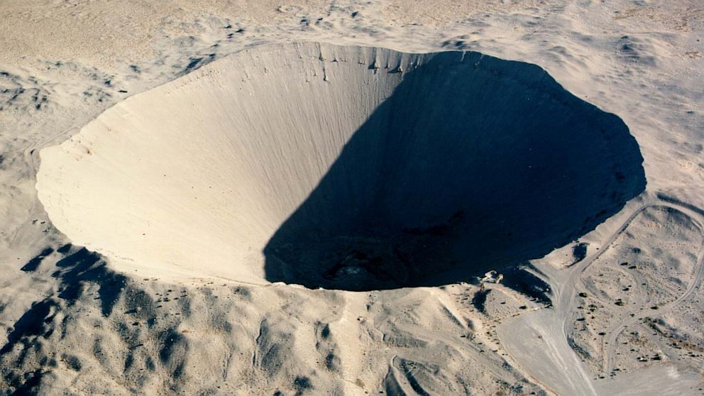 Sedan Crater was formed with a 100-kiloton nuclear explosive device. The device was buried 635 feet below the desert alluvium and was fired at the Nuclear Test Site in Jackass Flats, Nev., July 6, 1962.