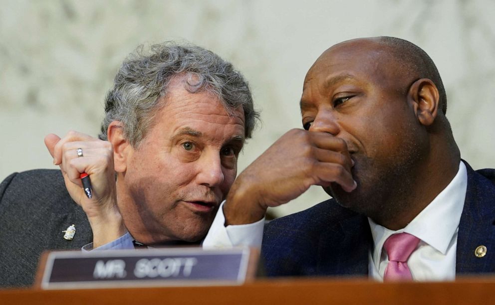 PHOTO: Senate Banking, Housing, and Urban Affairs Committee chairman Sherrod Brown speaks with Sen. Tim Scott before a hearing on "The Semiannual Monetary Policy Report to the Congress" on Capitol Hill in Washington, March 7, 2023.