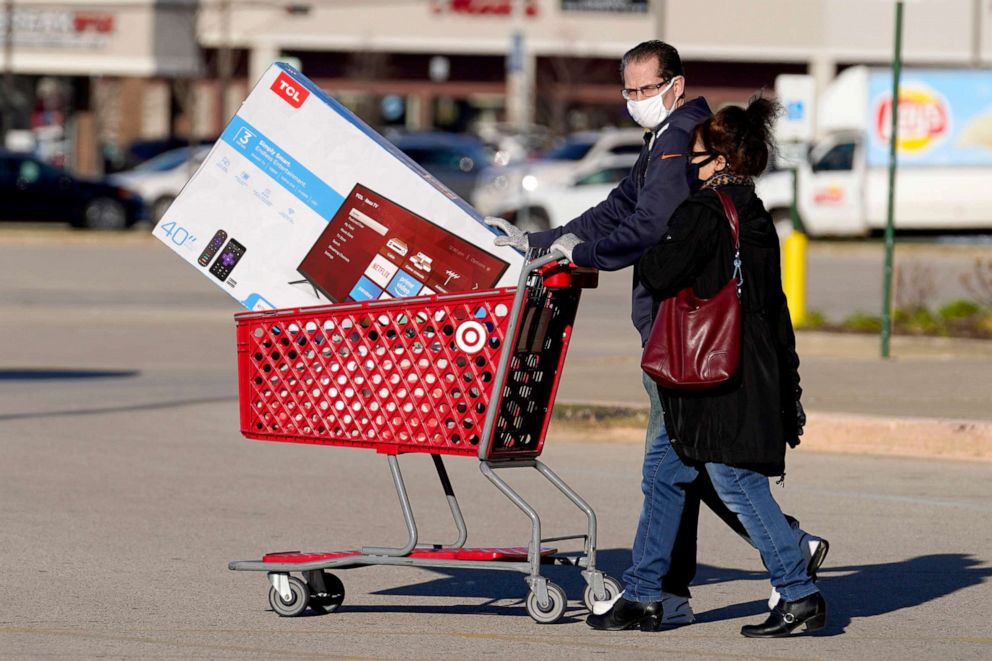 PHOTO: Shoppers leave a Target store after shopping in Niles, Ill., Nov. 28, 2020.