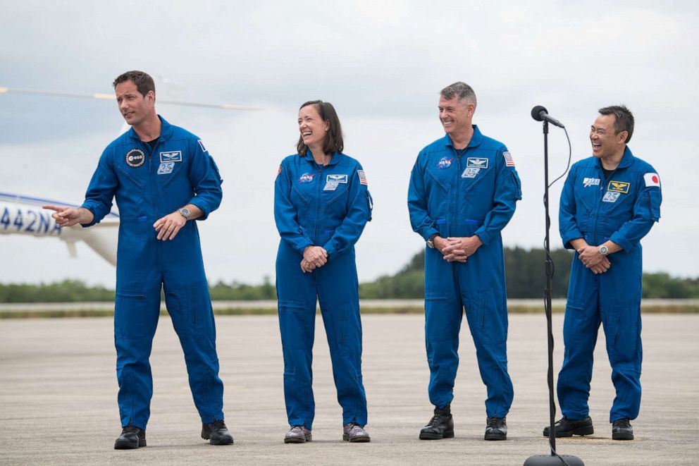 PHOTO: From left, ESA astronaut Thomas Pesquet, NASA astronauts Megan McArthur and Shane Kimbrough, and JAXA astronaut Akihiko Hoshide, react to comments at the Launch and Landing Facility at NASA's Kennedy Space Center April 16, 2021, in Fla.