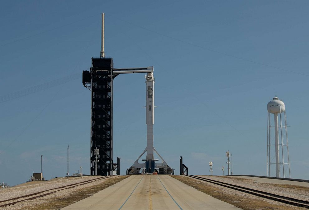 PHOTO: A SpaceX Falcon 9 rocket is seen as it is raised into a vertical position on the launch pad at Launch Complex 39A as preparations continue for the Demo-2 mission, May 21, 2020, at NASA's Kennedy Space Center in Florida. 