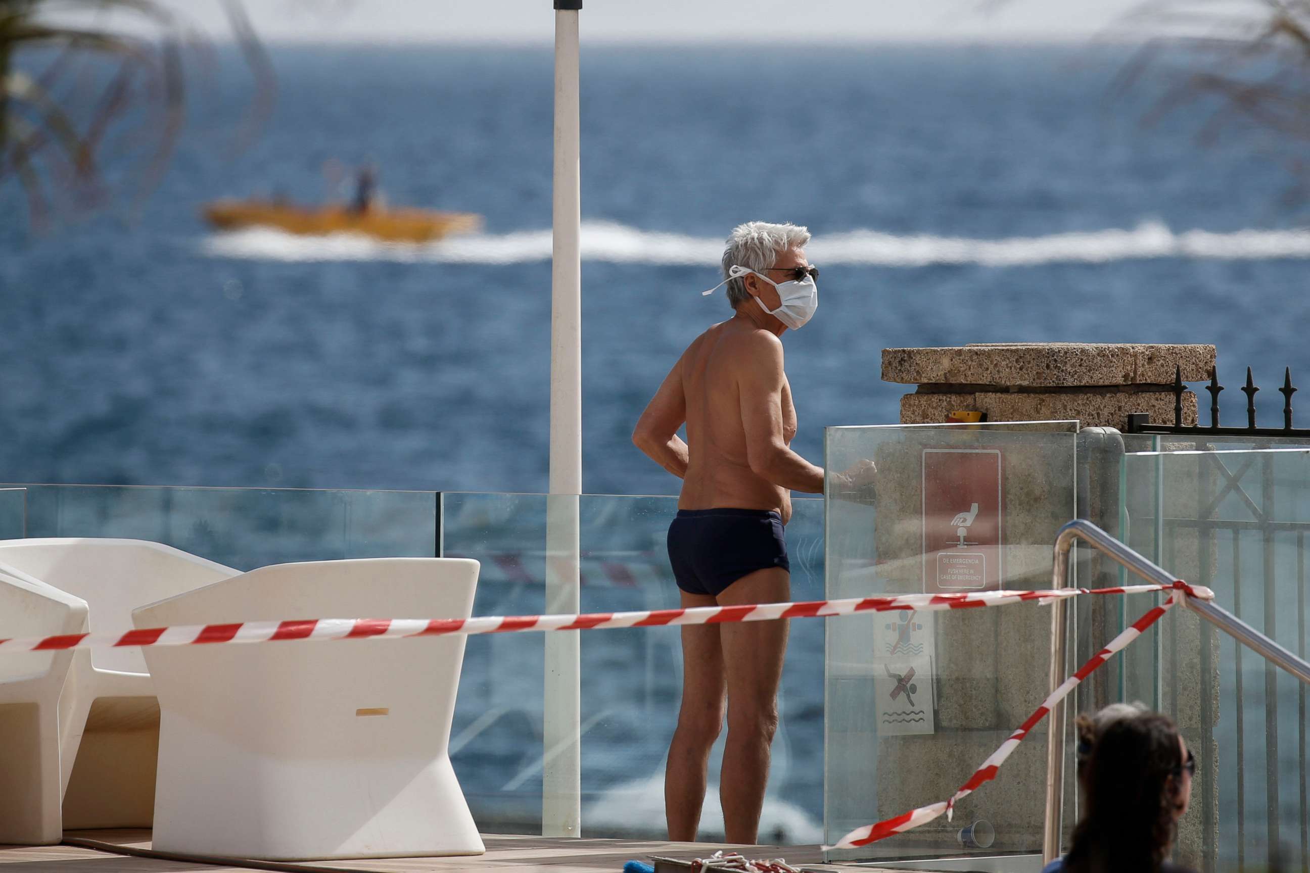 PHOTO: A tourist in quarantine inside the H10 Costa Adeje Palace hotel in La Caleta, in the Canary island of Tenerife, Spain, Thursday, Feb. 27, 2020.