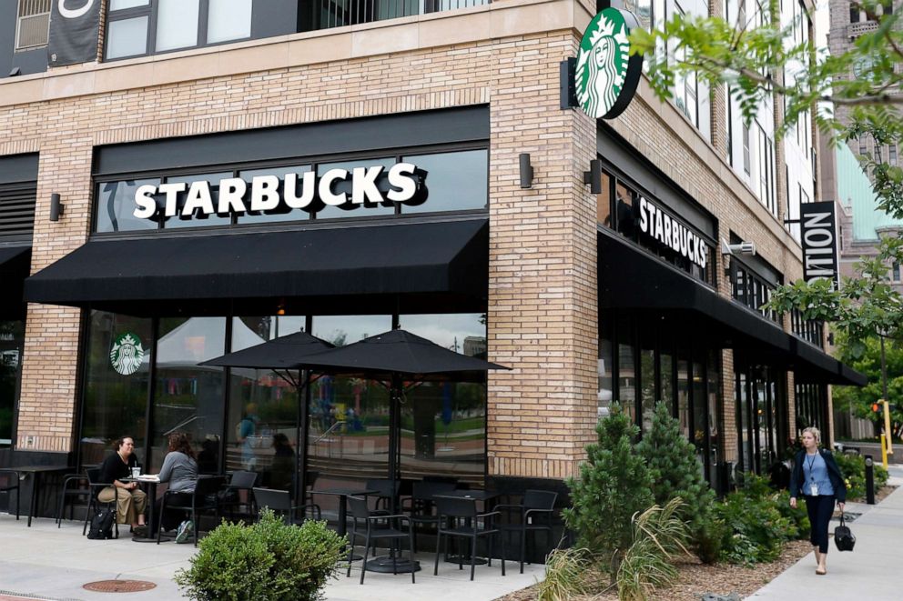 PHOTO: Customers visit at a Starbucks in Minneapolis.