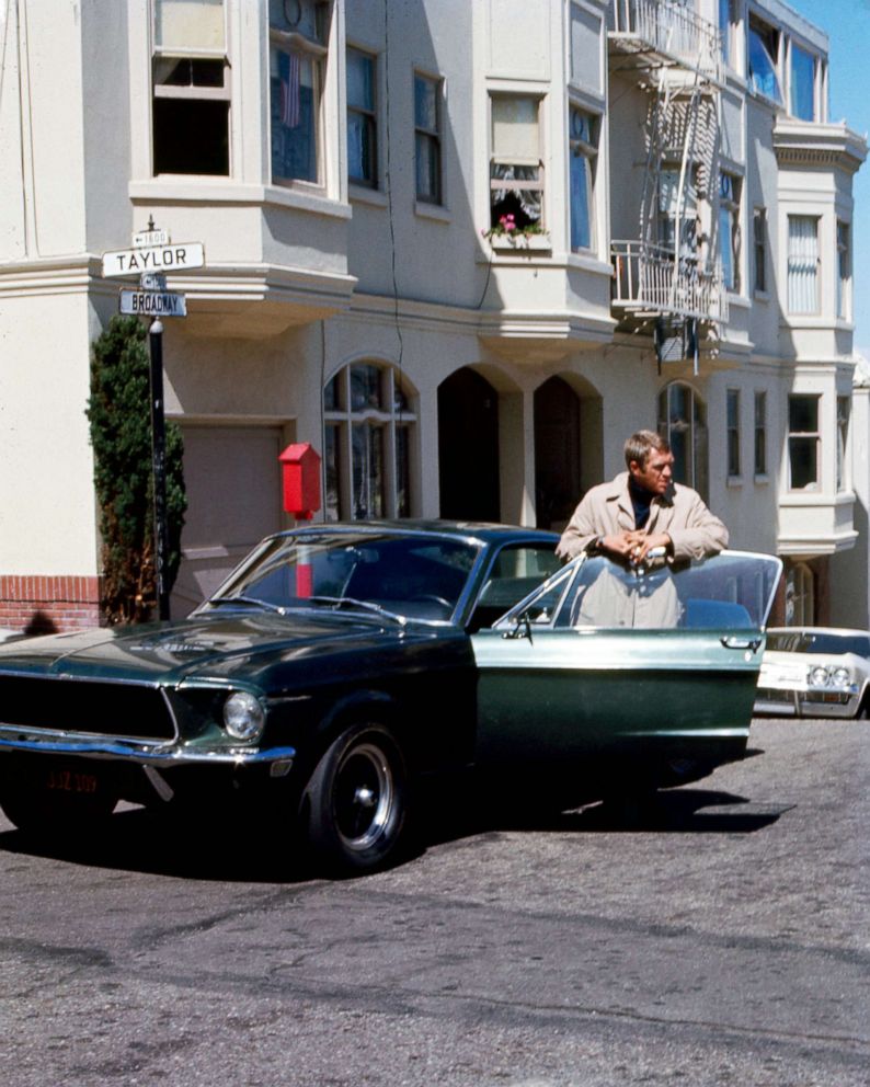 PHOTO: Steve McQueen, as Frank Bullitt, next to a Ford Mustang 390 GT 2+2 Fastback in a scene from "Bullitt."
