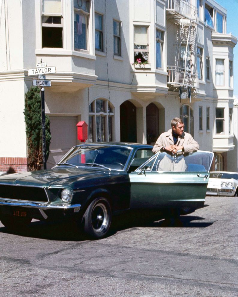 PHOTO: Actor Steve McQueen (1930 - 1980) as Frank Bullitt, next to a Ford Mustang 390 GT 2+2 Fastback in the crime thriller movie "Bullitt," in San Francisco, 1968.