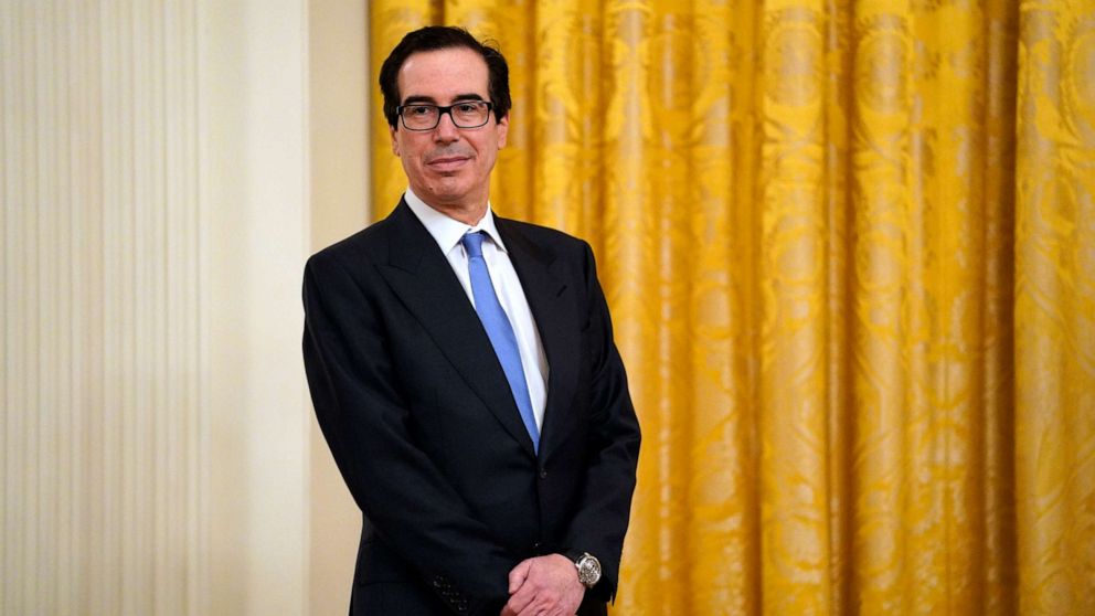 PHOTO: Treasury Secretary Steven Mnuchin listens as Ivanka Trump speaks during an event about the Paycheck Protection Program used to support small businesses during the coronavirus outbreak, in the East Room of the White House, April 28, 2020.