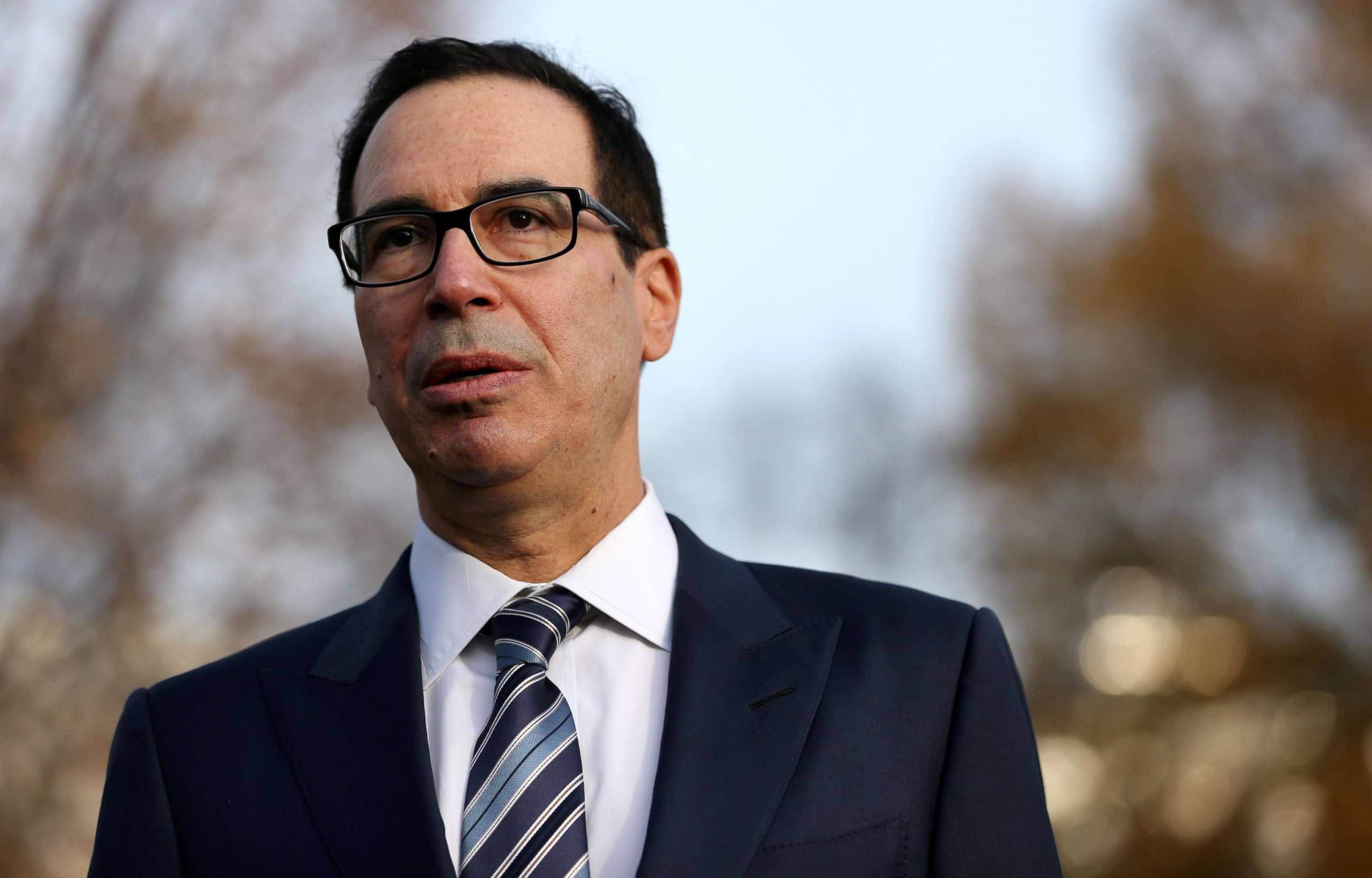 PHOTO: Treasury Secretary Steven Mnuchin speaks to the news media after giving a television interview at the White House in Washington, Dec. 3, 2018.