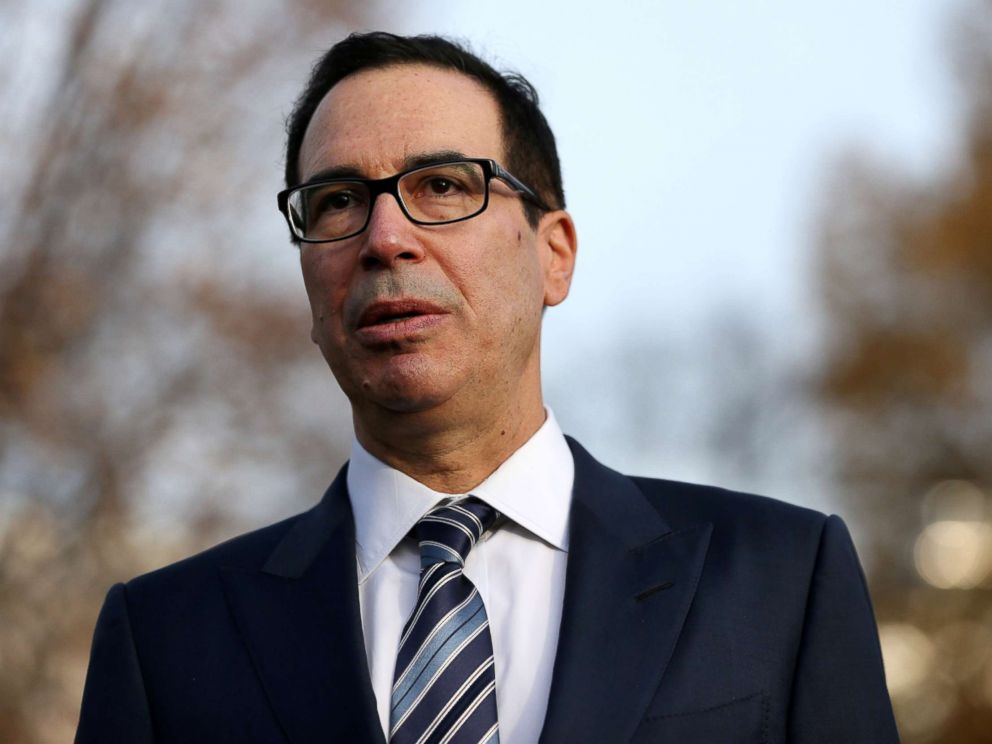 PHOTO: Treasury Secretary Steven Mnuchin speaks to the news media after giving a television interview at the White House in Washington, Dec. 3, 2018.