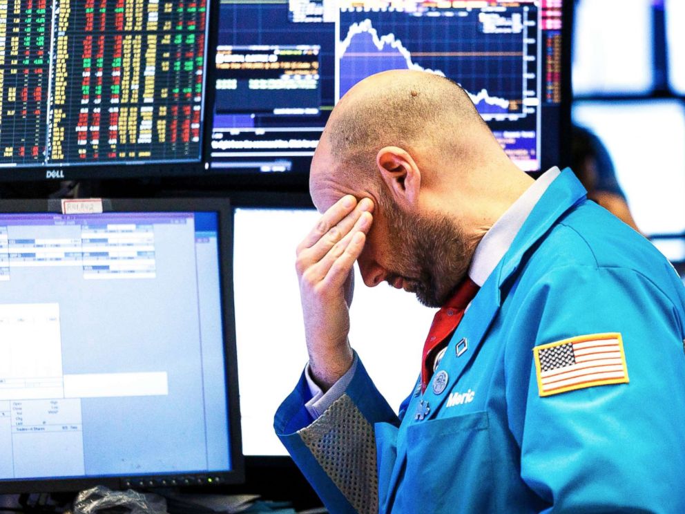 PHOTO: A trader works on the floor of the New York Stock Exchange at the closing bell in New York, Dec., 4 2018.