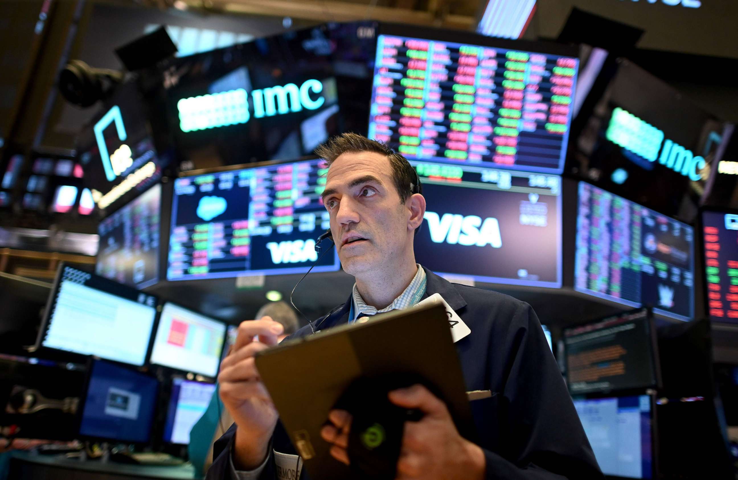 PHOTO: Traders work during the closing bell at the New York Stock Exchange on March 18, 2020 at Wall Street in New York City.