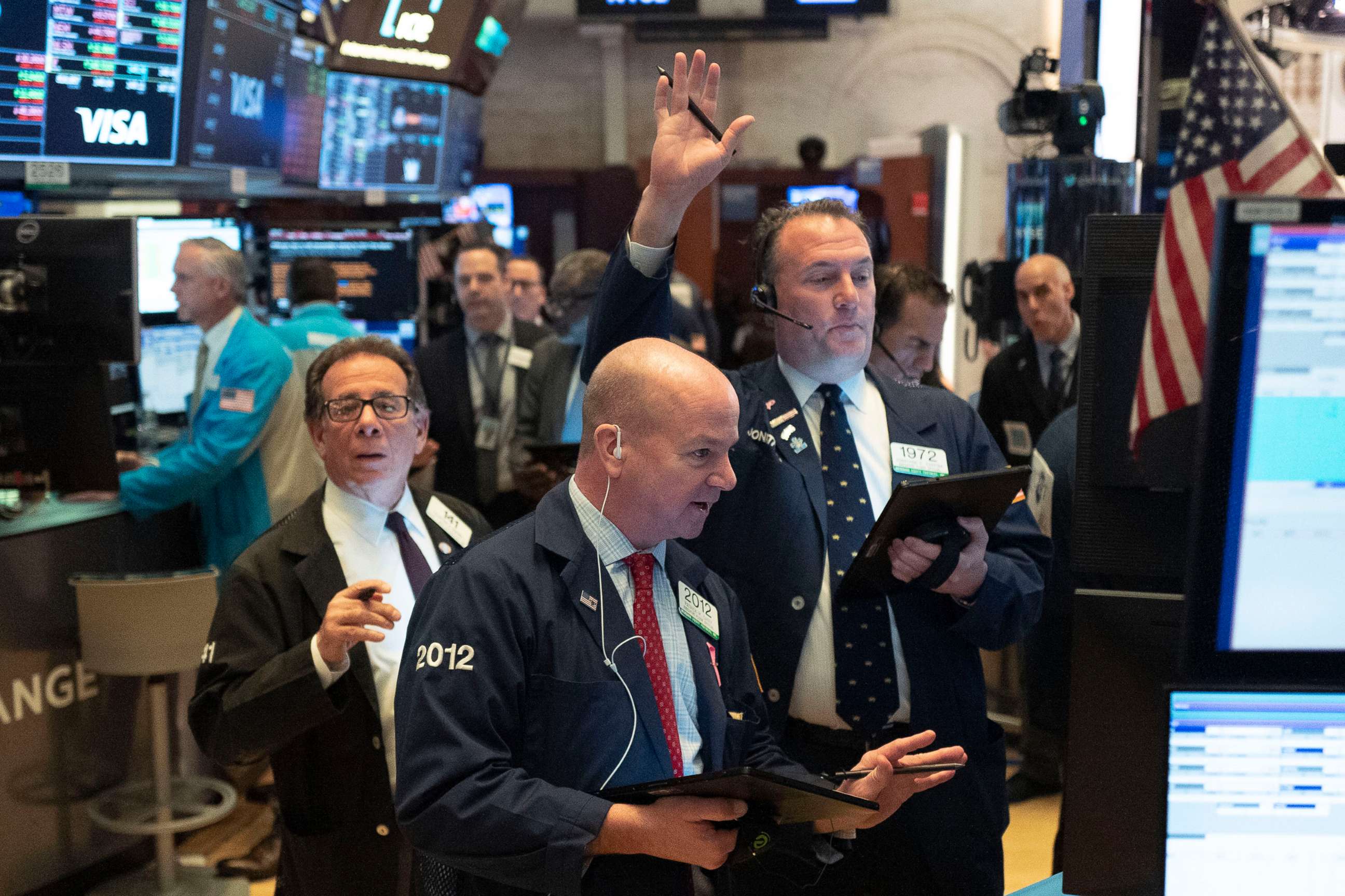 PHOTO: Traders work at the New York Stock Exchange, March 18, 2020.