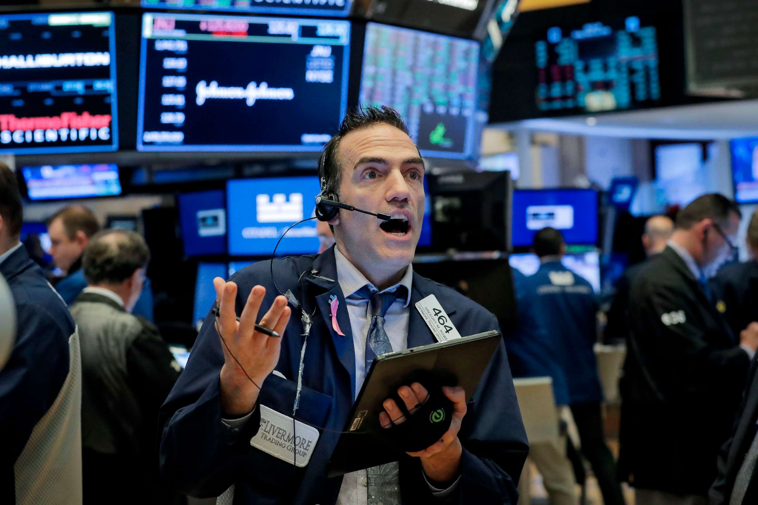 PHOTO: Traders work on the floor of the New York Stock Exchange in New York, March 20, 2020.