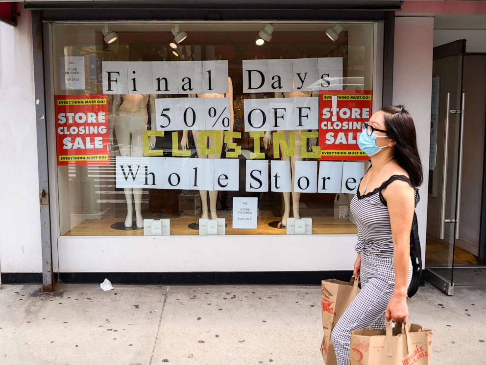 PHOTO: In this Sept. 26, 2020, file photo, a person walks by a going out of business sign displayed outside a retail store in New York.