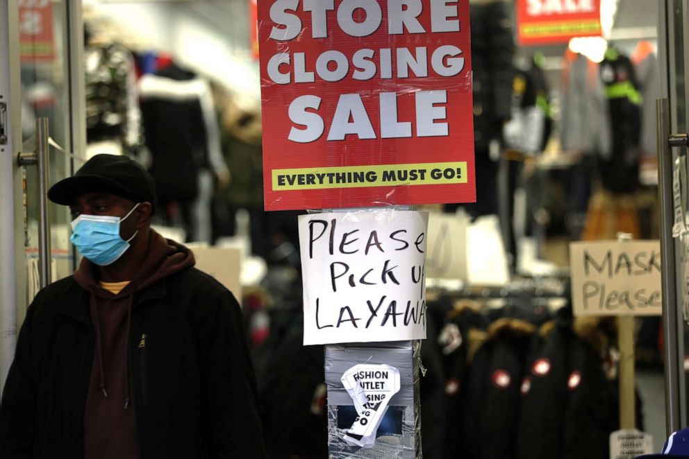 PHOTO: Sale signs are displayed in the window of a business on Dec. 01, 2020, in New York.